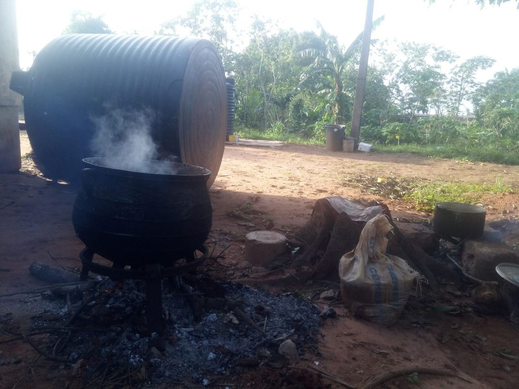 group cooking vegetables together in a kitchen